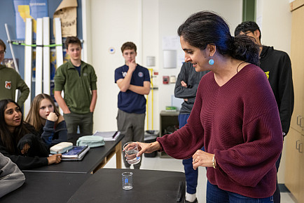 Nina Arnberg demonstrates various principles of physics to her class.