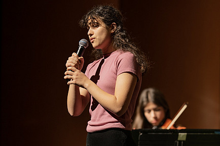 A student sings during the Spring Vocal and Instrumental Music Concert.
