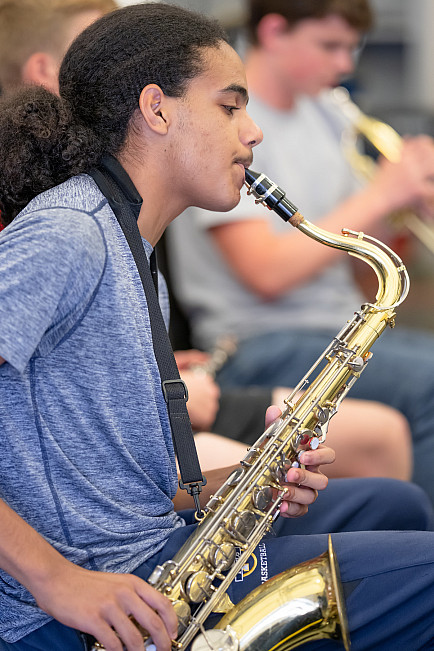 A saxophone player rehearses with Menlo's Jazz Band.