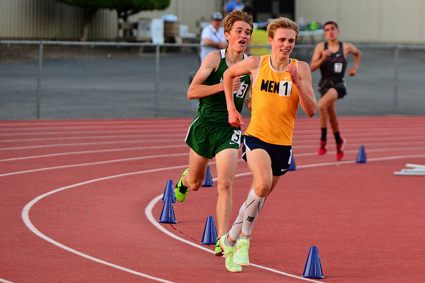 Menlo freshman Landon Pretre rounds the turn in the 3200 on his way to a second-place finish.