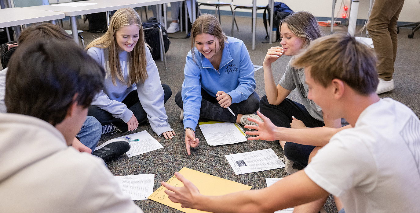 Matthew Nelson's Global Issues class plays an international trade game to simulate free markets.