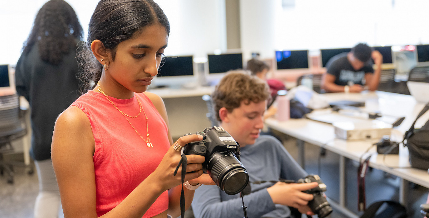 Students in Menlo's photography course work with their cameras.