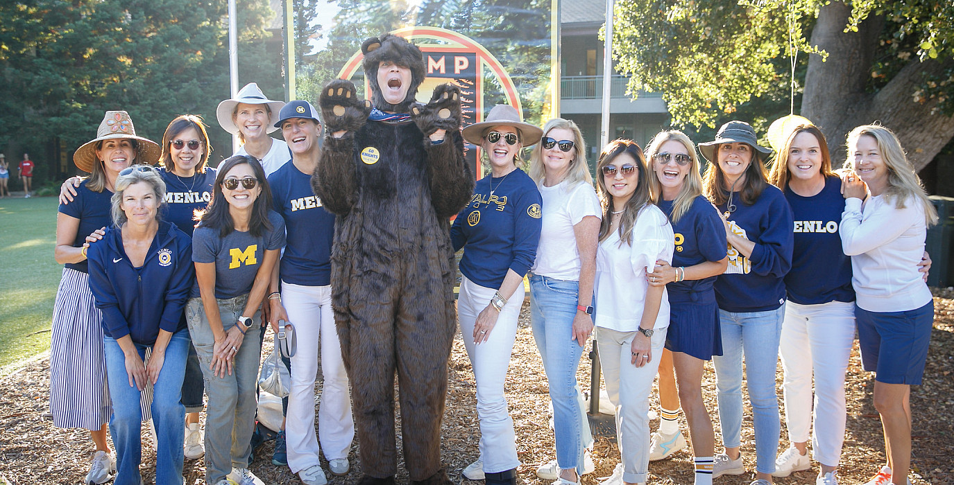 Head of School Than Healy and parent volunteers on the first day of school