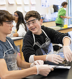 8th graders perform a dissection of a sheep eye in Allison Houghton's science class.