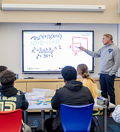 Michael Giardi teaches 8th grade math using blocks to help students visualize the process.