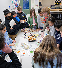 Middle School 22-23 French Vallerie Amzallag's 6th grade French students taste different varieties of cheese.