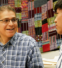 US History Global Peter Brown 32816617627 257021a883 k US History teacher and Global Studies Program Coordinator Peter Brown meets with a student