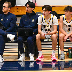 Menlo junior Aaron Lowe, next to Assistant Coach Matt Pierson,  takes extensive stats with the program he created this season.