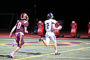 Menlo's Trevor van der Pyl runs into the end zone after reeling in a pass from Jack Freehill in the second quarter