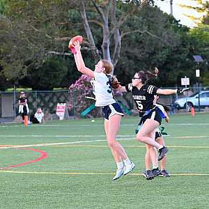 Menlo's Julia Axelrod grabs her first of two interceptions in Monday's game against Pioneer.
