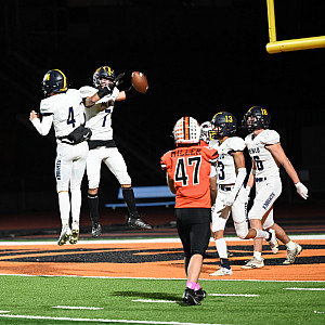 Menlo's Harry Houser (7) and Mikey McGrath celebrate after connecting on 1 50-yard touchdown against Half Moon Bay