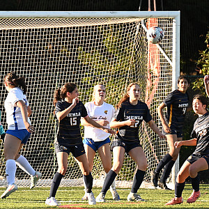 Menlo's defense works to get the ball out of the box against Terra Linda on Tuesday