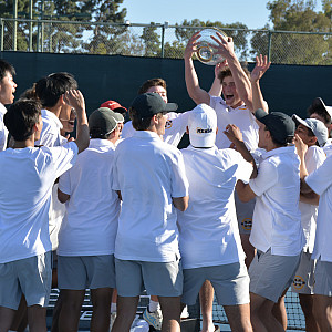 Arki Temsamani hoists the All-American Invitational Cup after Menlo School won the championship