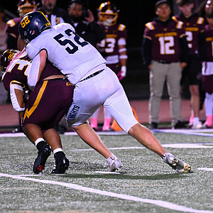 Knights senior Palmer Riley tackles M-A back Monty Turner in Friday's game