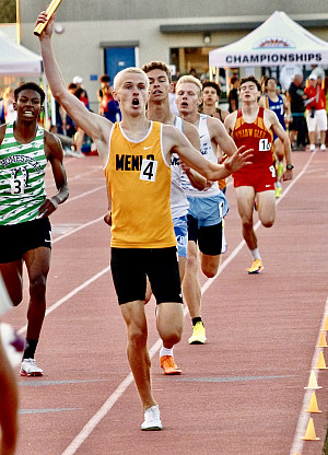 Henry Hauser crosses the finish line in first as the anchor of the 4x800, which set a meet record Saturday
