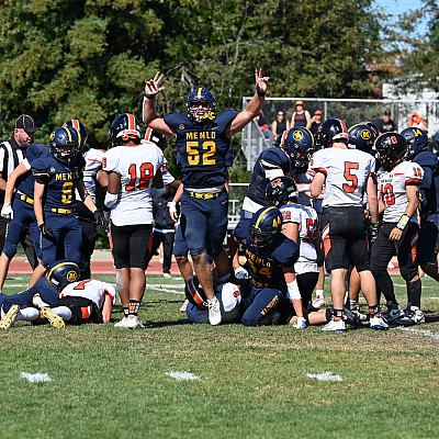 Palmer Riley celebrates after the Knights cause and recover a fumble