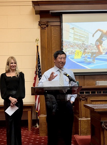 Menlo track & field and cross country coach Jorge Chen speaks at the Peninsula Sports Hall of Fame induction ceremony for Olympian Ma...