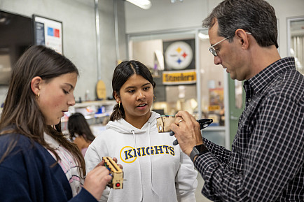 A 9th grade seminar class meets in Whitaker Lab.