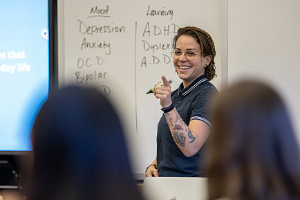 Upper School Counselor Ms. Dominguez leads a 9th grade seminar session