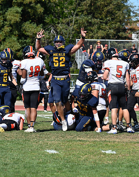 Palmer Riley celebrates after the Knights cause and recover a fumble