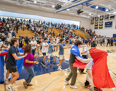 Menlo School students form a conga line during the Latinx and Hispanic Heritage Month Assembly