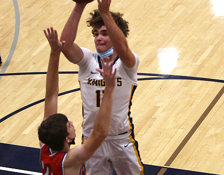 Menlo senior Chris Cook poured in 18 points and had nine rebounds to lead Menlo past Pinewood.