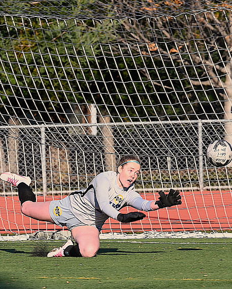 Menlo senior Sam Sellers made a diving one-handed stop late in the second half