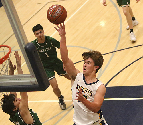 Menlo junior Cort Halsey delivers a basket in the second quarter of Tuesday's NorCal game.
