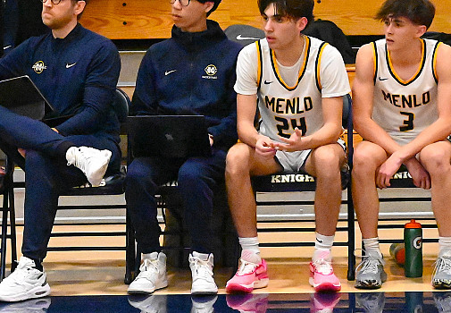 Menlo junior Aaron Lowe, next to Assistant Coach Matt Pierson,  takes extensive stats with the program he created this season.