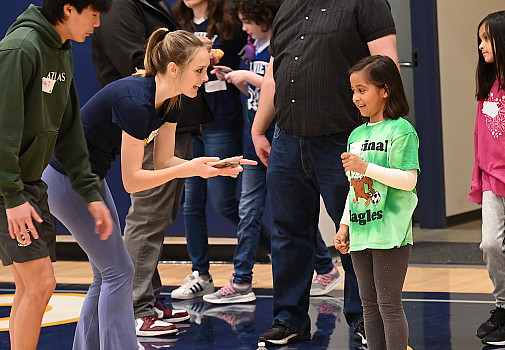 Brady Jung and Tatum Herrin talk with a student at a recent Special Olympics Field Day at Menlo