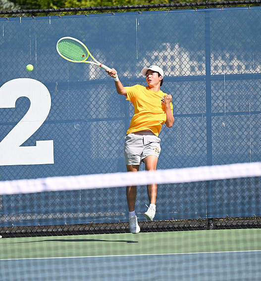 Menlo's Lucas Huang hits a return in a match against Los Gatos.
