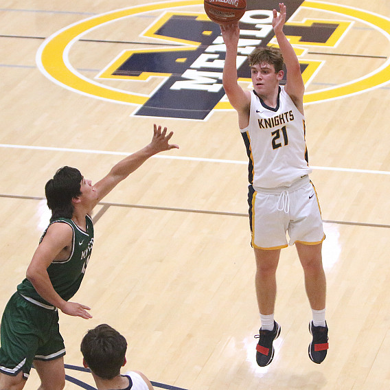 Menlo junior Will Eggemeier fires from beyond the arc in the first half against Manteca