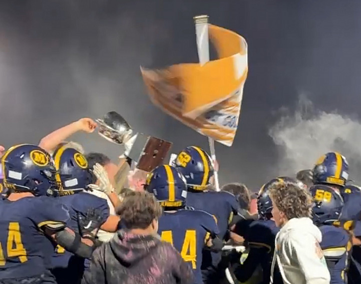 Menlo School players celebrate with fans after beating rival SHP 21-6 on Friday night