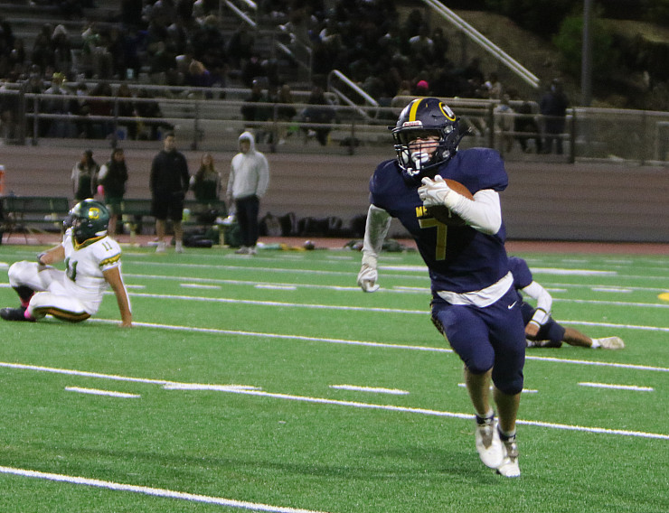 Menlo senior Jack Giesler tears up the field against Capuchino. Giesler finished with five catches for 87 yards and a TD and 36 rushing y...