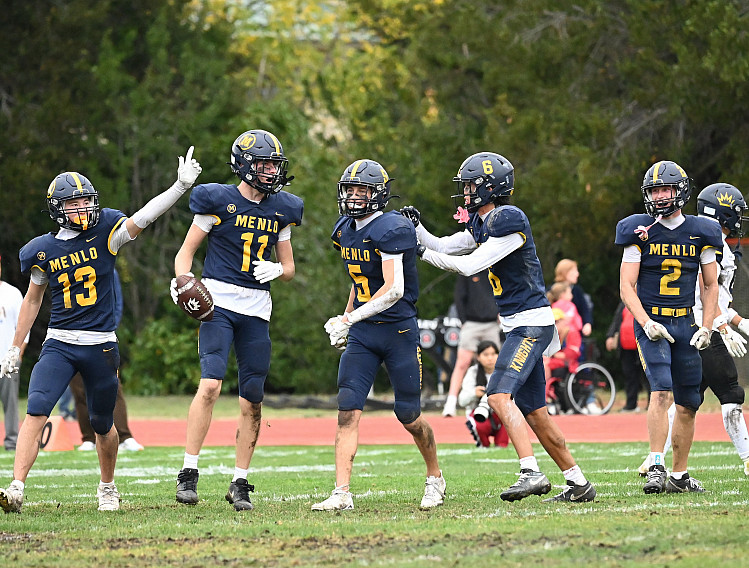 Menlo sophomore Drew Housser (11) picked off a pass against The King's Academy.