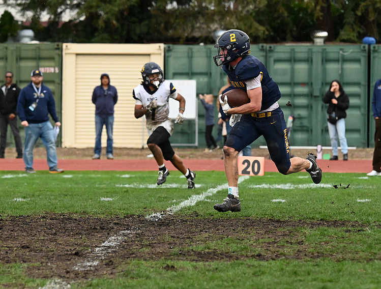 Menlo senior Trevor van der Pyl picks up a big gain on a reception against The King's Academy in Saturday's CCS quarterfinal