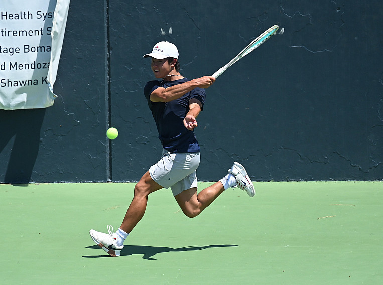 Menlo senior Cooper Han fires a shot at center court