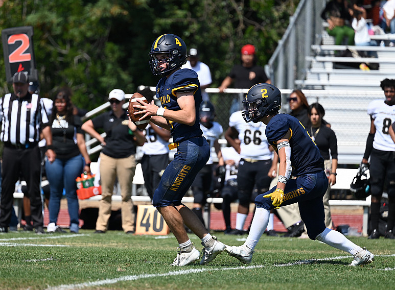 2483: Menlo senior Mikey McGrath looks downfield to pass with Nicky Scacco protecting