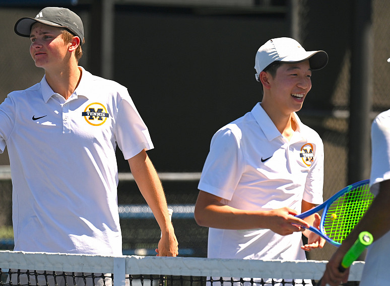 Miles Burnett and Riley Huang celebrate after their victory at No.2 doubles in the CCS Championships