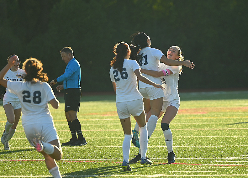 Knights' Dorothy Zhang leaps to celebrate with Tabitha Corcoran after Corcoran's goal sailed into the corner of the goal