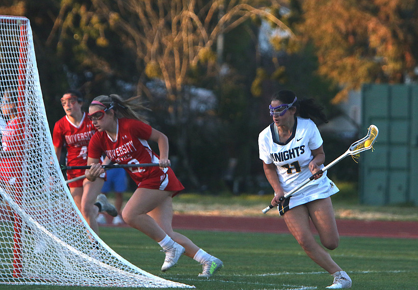 Knights freshman Ari Kaufman wraps around the goal to find an outlet in Tuesday's game against University.