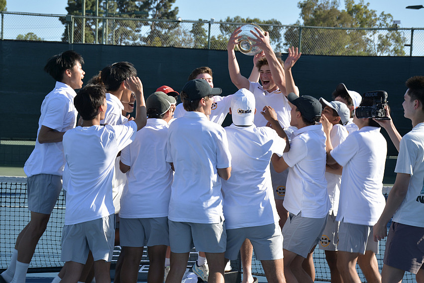 Arki Temsamani hoists the All-American Invitational Cup after Menlo School won the championship