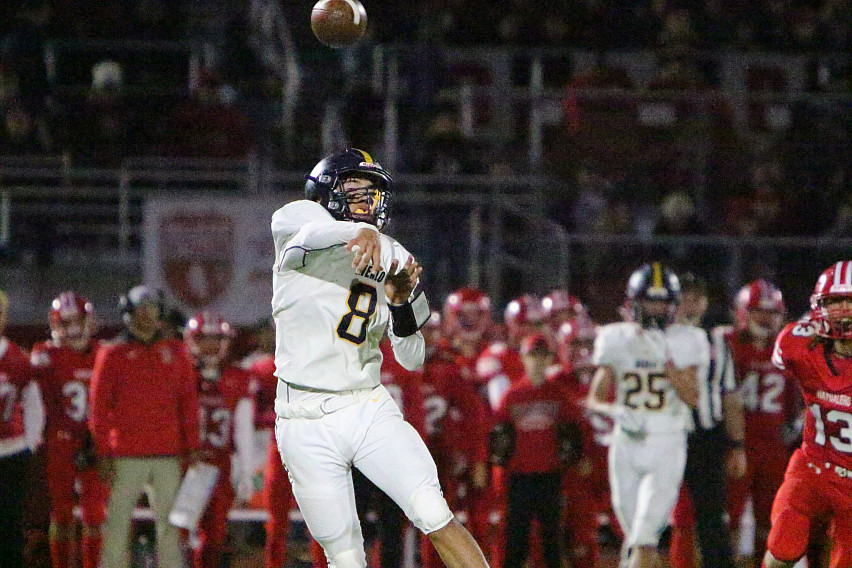 Menlo senior Sergio Beltran fires a pass against San Benito. He finished the game with a CCS record 51 passing touchdowns in a season, an...