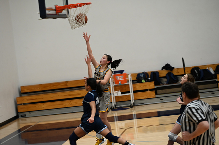 Menlo sophomore Karen Xin delivers a layup in the first half against Crystal.