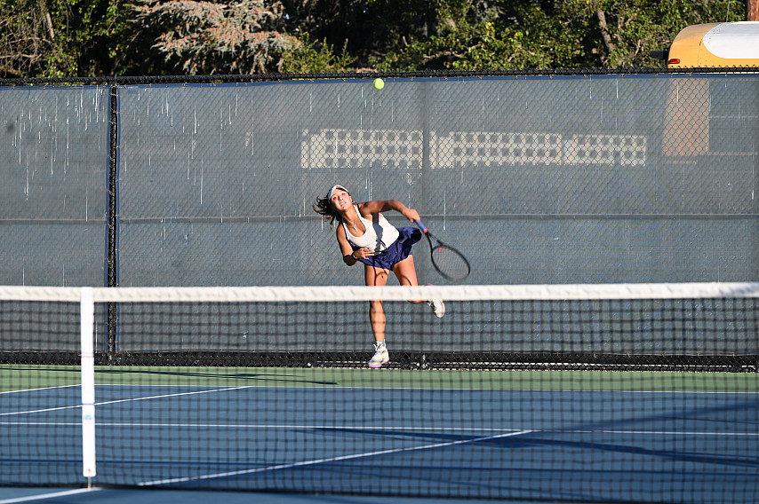 Menlo junior Izzy Klugman serves against SHP and teamed with Kate Hsia to win No,.1 doubles