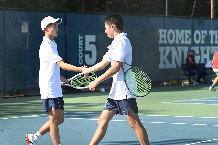 Riley Huang and Sage Ash celebrate a point
