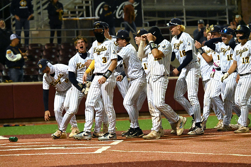 The Knights celebrate a walk-off single from senior right fielder Renner Barnett, left, in the ninth inning for a 7-6 win over Aptos in t...
