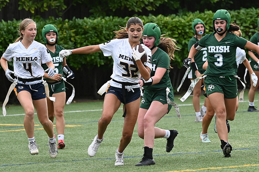 Menlo's Olivia Capasso gains yards after an interception