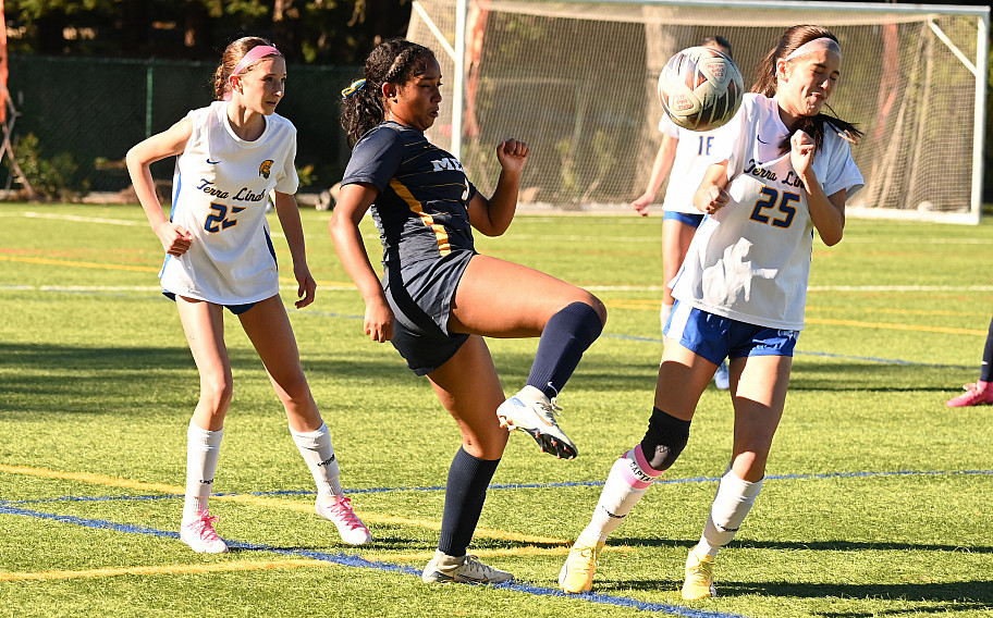 Menlo junior Jazlyn Romero controls a loose ball against Terra Linda